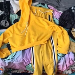 A two piece yellow track suit
